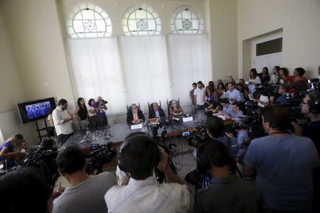 Researcher Myrna Bonaldo (R), the President of Oswaldo Cruz Foundation Paulo Gadelha (C) and Wilson Savino (L), Director of the Oswaldo Cruz Institute attend a news conference in Rio de Janeiro, Brazil, February 5, 2016. REUTERS/Ricardo Moraes