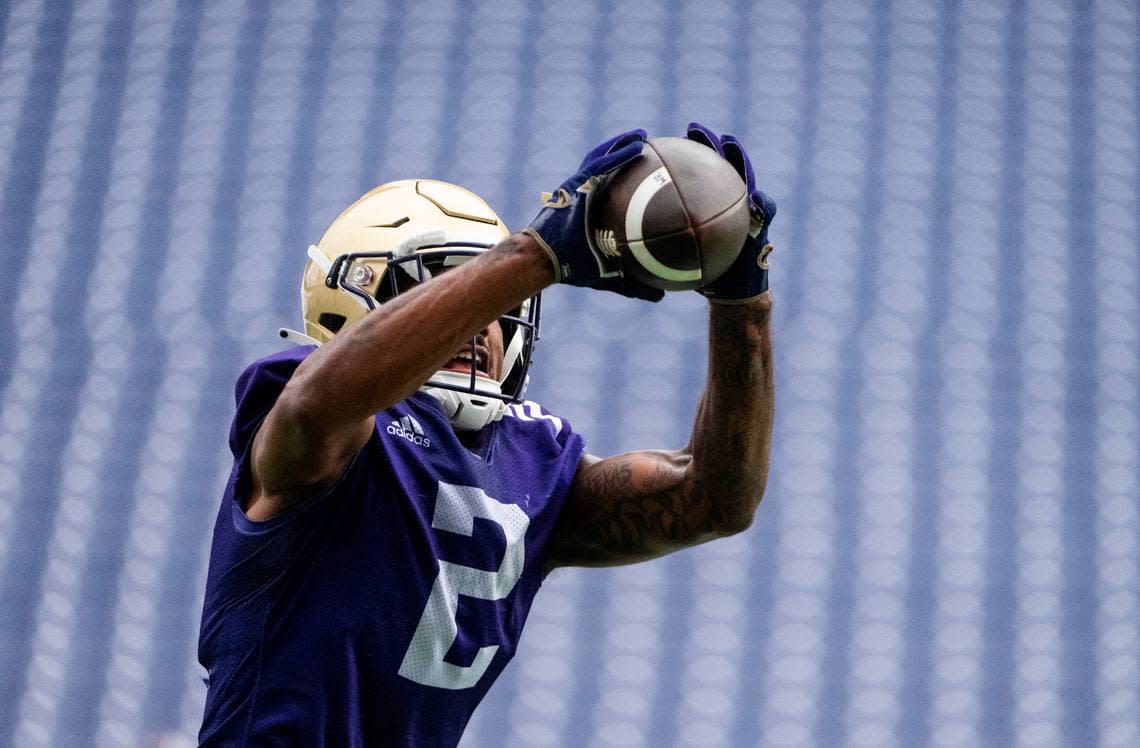 University of Washington Huskies wide receiver Ja’Lynn Polk, 2, jumps to catch a ball during a drill at the first day of Fall practice at Husky Stadium on Thursday, Aug. 4, 2022 in Seattle, Wash.