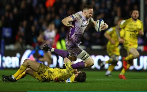 Jonny Hill of Exeter Chiefs powers past the challenge of Vincent Rattez of La Rochelle during the Heineken Champions Cup Round 6 match between Exeter Chiefs and La Rochelle at Sandy Park on January 18, 2020 in Exeter, England - Credit: Getty Images