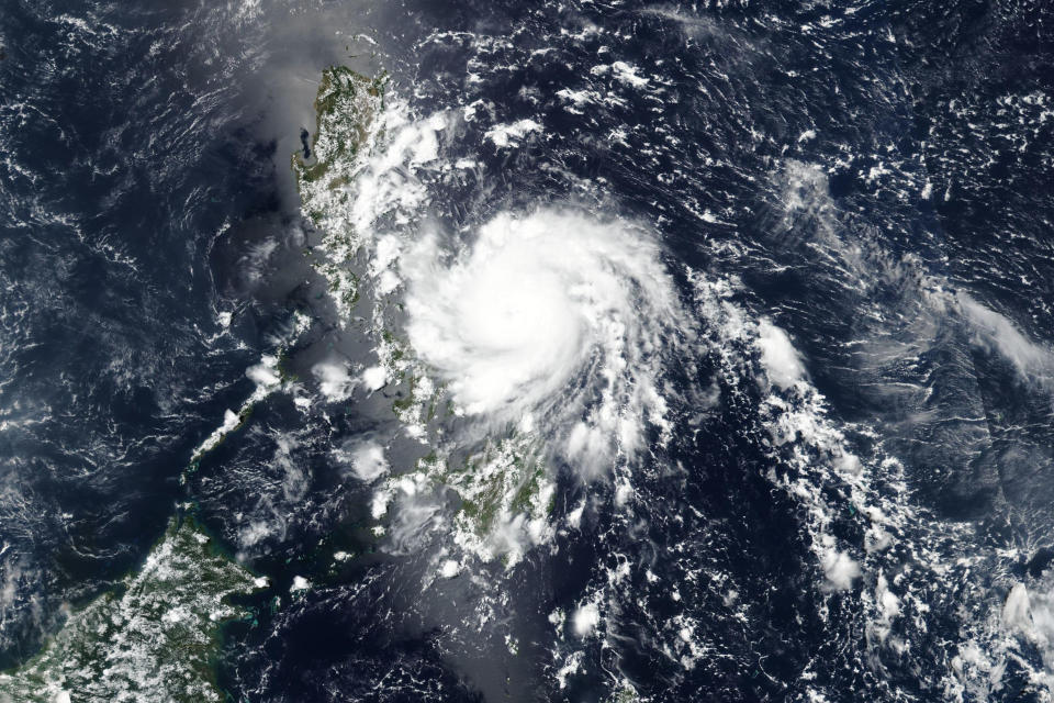 This Thursday, May 14, 2020, satellite image released by NASA shows Typhoon Vongfong roaring toward the eastern Philippines. The strong typhoon slammed into the eastern Philippines on Thursday, knocking out power and threatening food crops in a new emergency for a country already overwhelmed by the coronavirus pandemic. (NASA Worldview, Earth Observing System Data and Information System (EOSDIS) via AP)