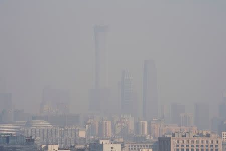 The City skyline is seen amid smog ahead of Chinese Lunar New Year in Beijing, China February 13, 2018. Picture taken February 13, 2018. REUTERS/Jason Lee