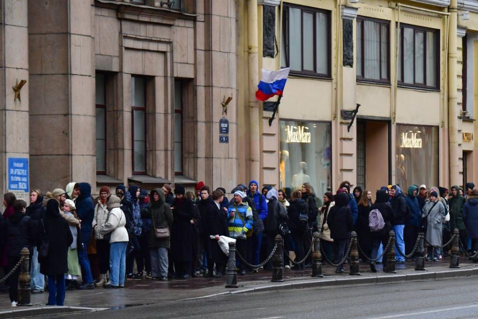 People queue outside a polling station during Russia's presidential election in Saint Petersburg on March 17, 2024. (Olga Maltseva/AFP via Getty Images)