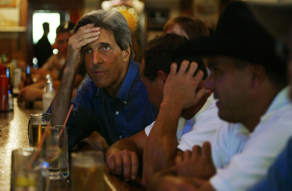 <p>Democratic presidential candidate Sen. John Kerry watches the Green Bay Packers game at a bar September 26, 2004 in Mt. Horeb, Wisconsin. Kerry is planning to stay in Wisconsin for three days as he prepares for the debate against President George W. Bush. (Photo by Chris Hondros/Getty Images) </p>