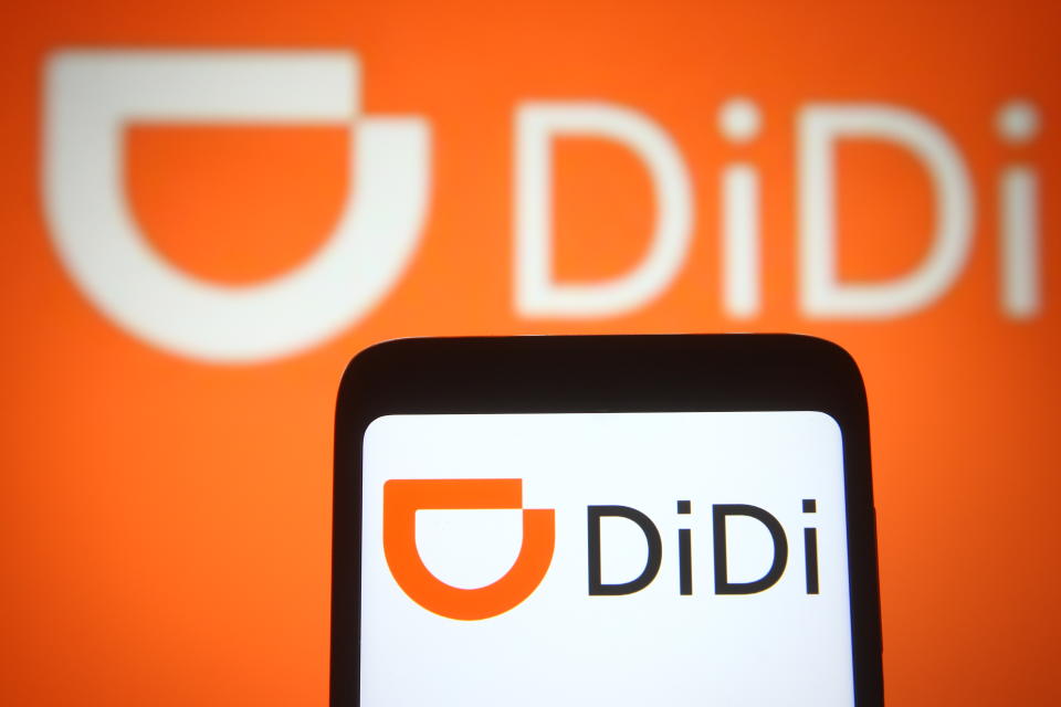 UKRAINE - 2021/03/30: In this photo illustration the DiDi (Didi Chuxing Technology Co.) logo of a Chinese transport company is seen on a smartphone and a pc screen. (Photo Illustration by Pavlo Gonchar/SOPA Images/LightRocket via Getty Images)