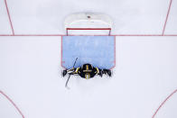 Boston Bruins' Jeremy Swayman stretches during the second period of an NHL hockey game against the Philadelphia Flyers, Wednesday, Oct. 20, 2021, in Philadelphia. (AP Photo/Matt Slocum)