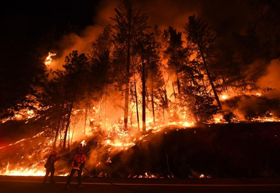 Firefighters try to control a back burn as the Carr fire spreads towards the towns of Douglas City and Lewiston near Redding, Calif. on July 31, 2018.<span class="copyright">Mark Ralston—AFP/Getty Images</span>