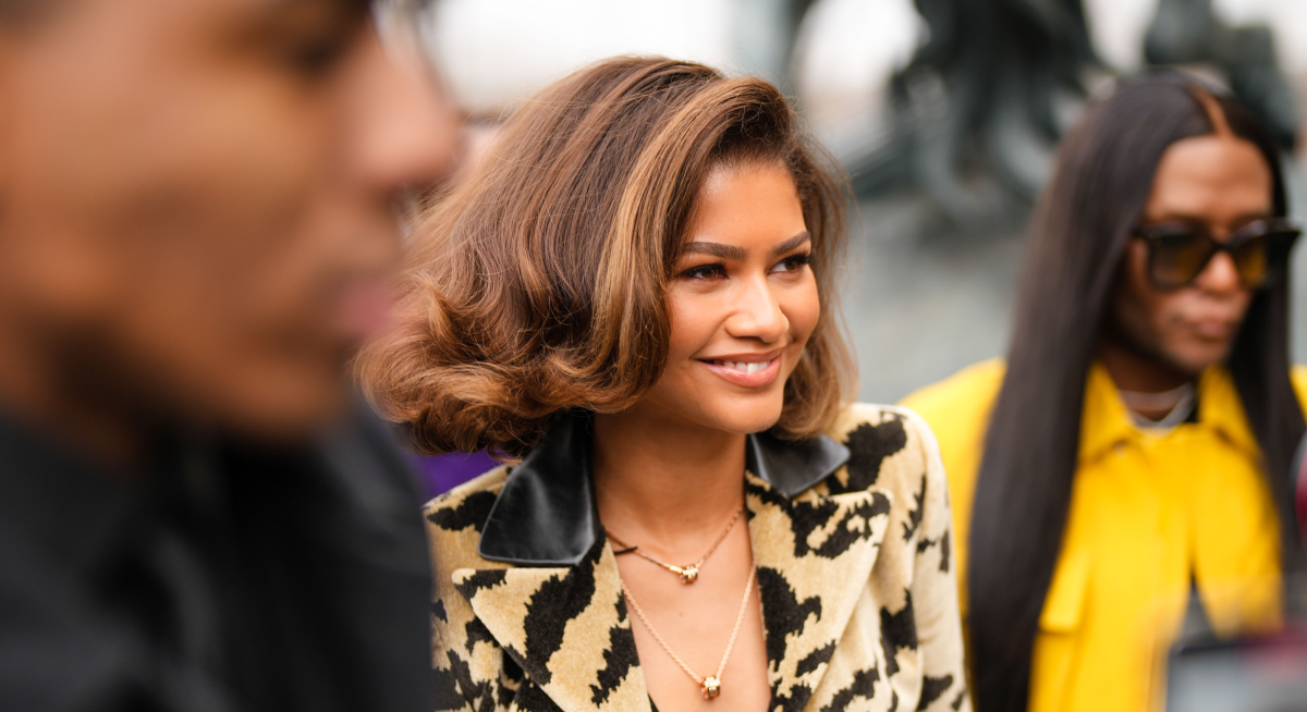 Zendaya Attends the Louis Vuitton Fall 2023 Fashion Show, Zendaya Pairs a  Tiny Micro Bra With Tiger-Print Boots