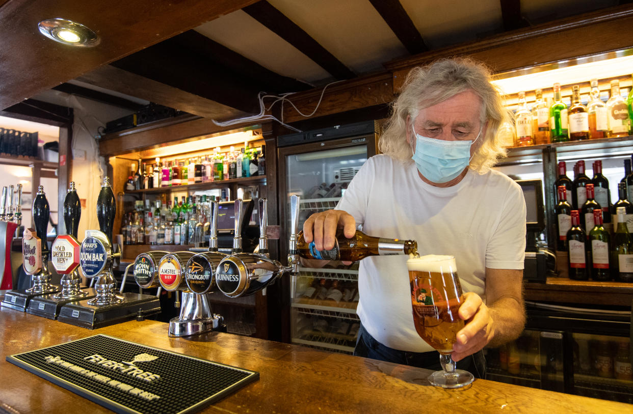 Phil Weaver, owner of The Old Smithy in Church Lawford, Warwickshire pours a drink as pub and hospitality bosses have cheered the Government's proposals to allow customers through their doors again on July 4 as "a welcome relief". (Photo by Joe Giddens/PA Images via Getty Images)