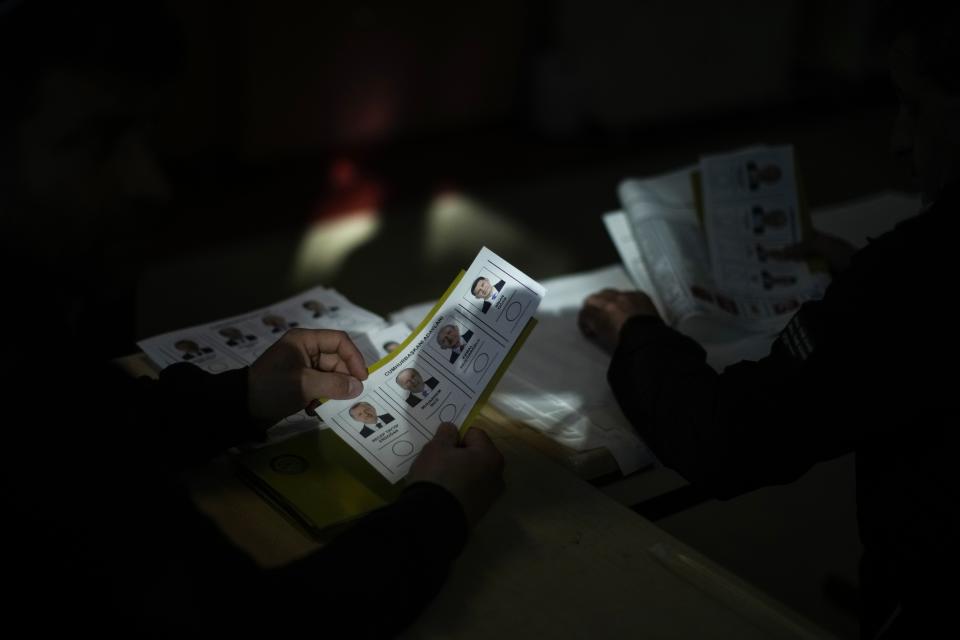 Election representative prepare the ballots at a polling station at a polling station in Istanbul, Turkey, Sunday, May 14, 2023. Voters in Turkey go to the polls on Sunday for pivotal parliamentary and presidential elections that are expected to be tightly contested and could be the biggest challenge Turkish President Recep Tayyip Erdogan faces in his two decades in power. (AP Photo/Francisco Seco)