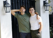 TikTok personalities Ian Paget, left, and Chris Olsen pose for a portrait in West Hollywood, Calif. on Oct. 20, 2020. Paget and Olsen, gay partners in Los Angeles, have amassed more than 4 million followers who love and encourage them as they hunker down at home, churning out goofy dance videos and playing the constant pranks that are stock-in-trade on TikTok. (AP Photo/Chris Pizzello)