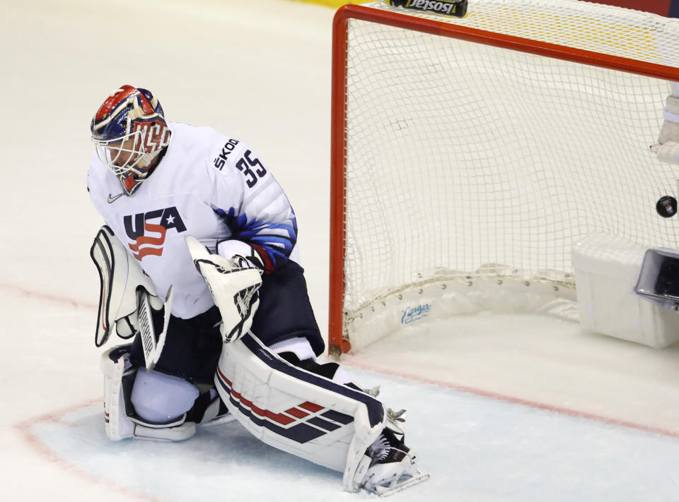 Goaltender Cory Schneider of the US fails to make a save during the Ice Hockey World Championships group A match between Canada and the United States at the Steel Arena in Kosice, Slovakia, Tuesday, May 21, 2019. (AP Photo/Petr David Josek)