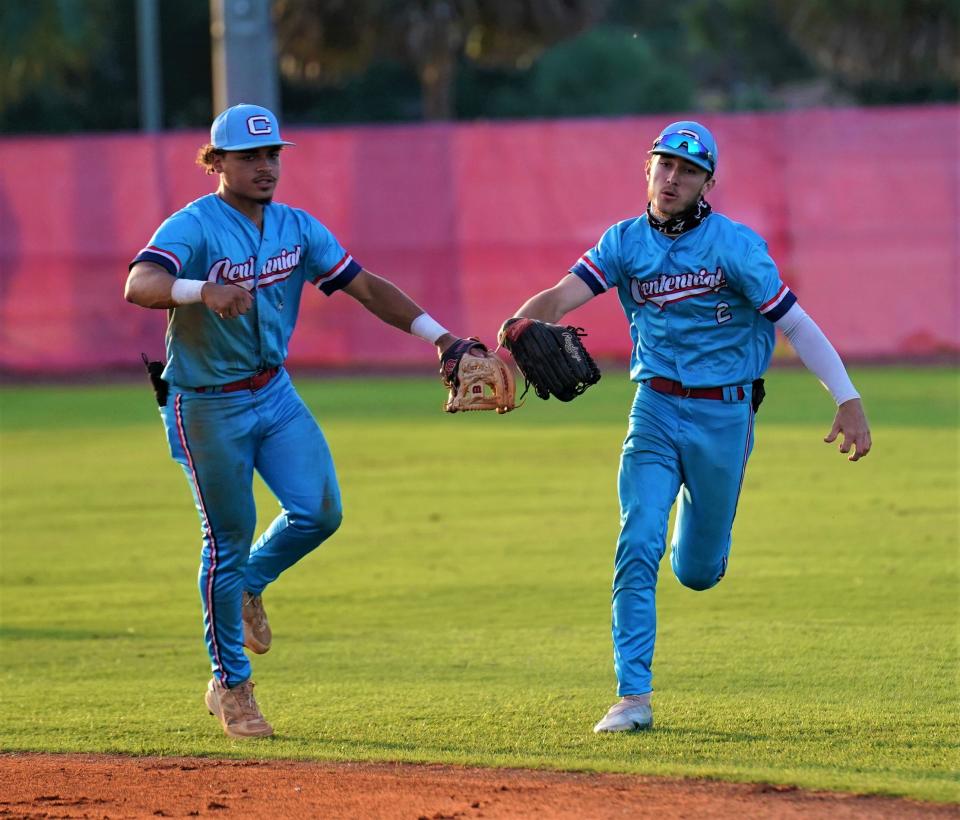 Centennial center fielder Brian O'Shea is congratulated by Isaiah Ramos after making a catch in the second inning against Vero Beach in the District 10-7A title game on Thursday, May 4, 2023 in Vero Beach. Centennial won 7-6.