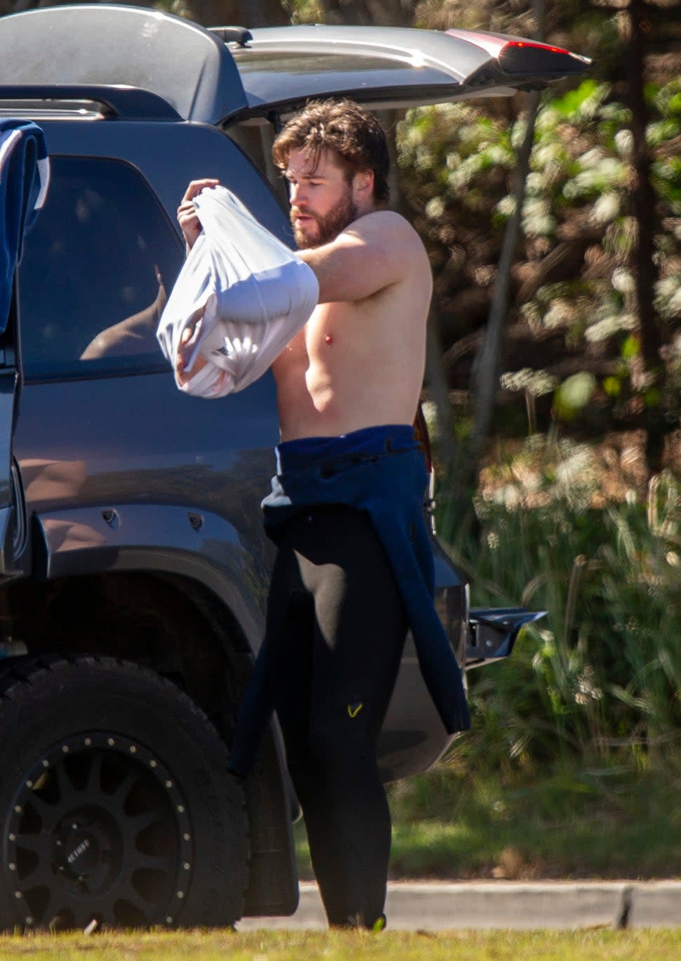 Liam Hemsworth Surfing