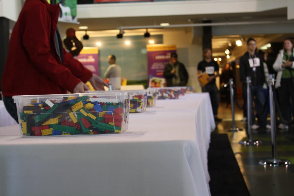 A LEGOLAND employee prepares for participants to start building.