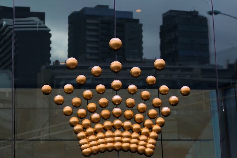 FILE PHOTO: The logo of Australian casino giant Crown Resorts Ltd adorns a hotel and casino complex in Melbourne, Australia