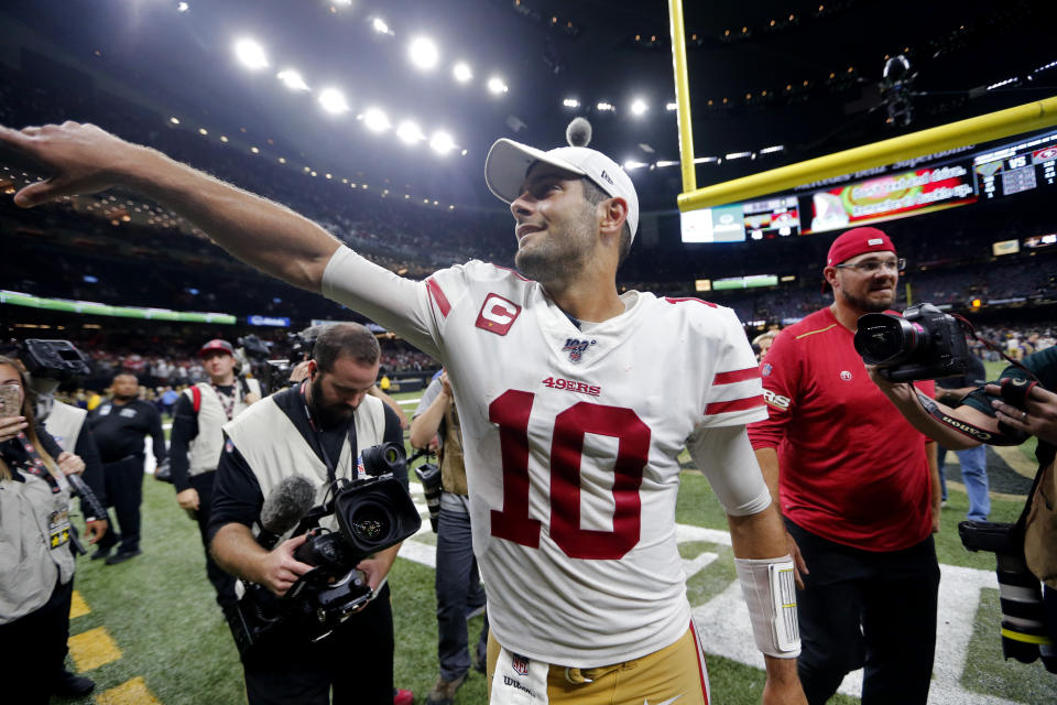 San Francisco 49ers quarterback Jimmy Garoppolo (10) celebrates after an NFL football game against the New Orleans Saints in New Orleans, Sunday, Dec. 8, 2019. The 49ers won 48-46. (AP Photo/Brett Duke)