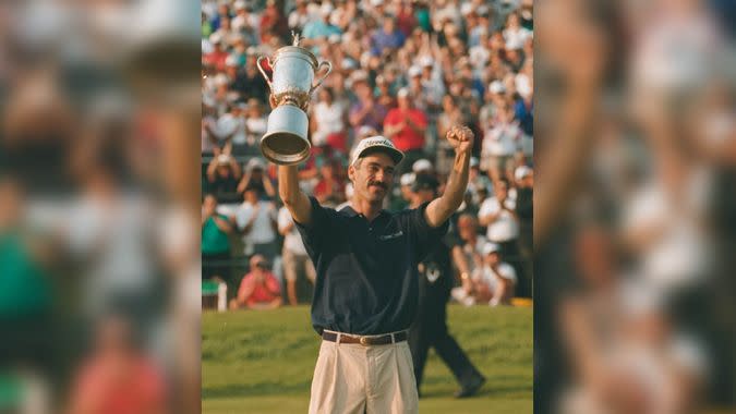 PAVIN Corey Pavin holds the trophy on the 18th green after winning the 95th U.