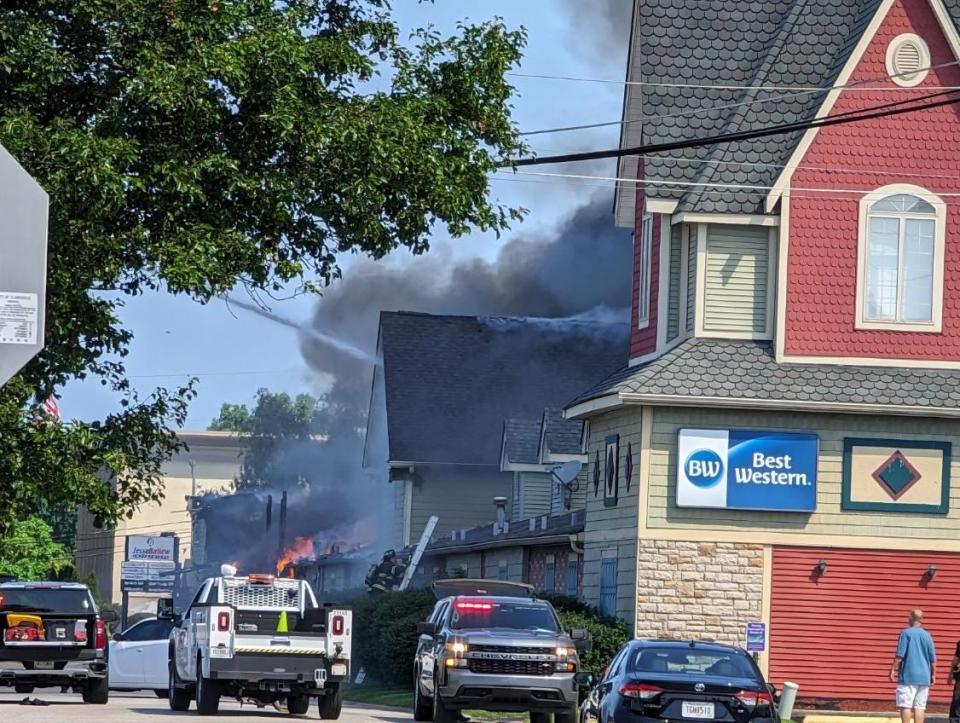 Smoke billows out of the Clarksville, Indiana Best Western Green Tree Inn on July 23, 2023.