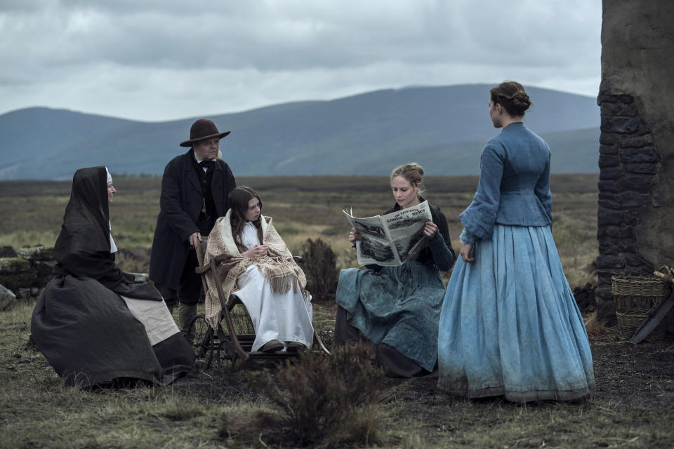 This image released by Netflix shows, from left, Josie Walker as Sister Michael, Toby Jones as Dr McBrearty, Kíla Lord Cassidy as Anna O'Donnell, Niamh Algar as Kitty O'Donnell, Florence Pugh as Lib Wright in a scene from "The Wonder." (Aidan Monaghan/Netflix via AP)