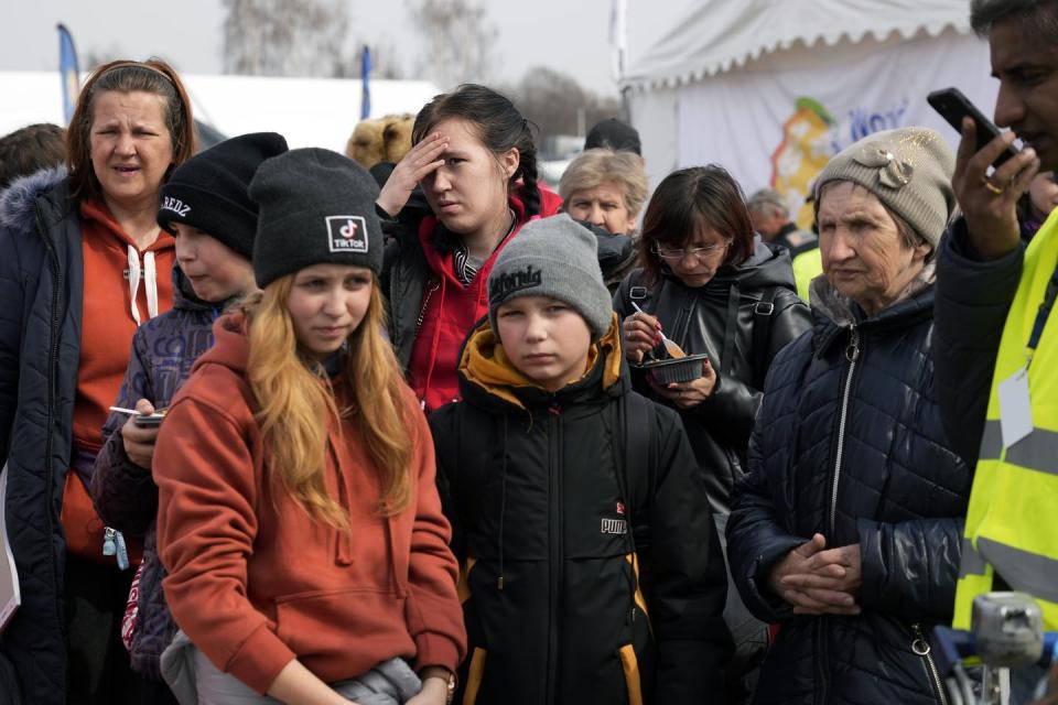 <span class="caption">Ukrainian refugees arrive at border crossing in Medyka, southeastern Poland, on March 30.</span> <span class="attribution"><span class="source">(AP Photo/Sergei Grits)</span></span>