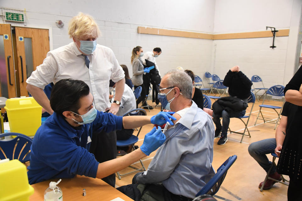 Prime Minister Boris Johnson during a visit to the Stow Health Vaccination centre in Westminster, central London. Picture date: Monday December 13, 2021.