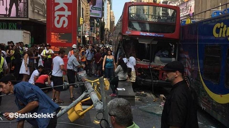 Double-decker tour buses collide in Times Square