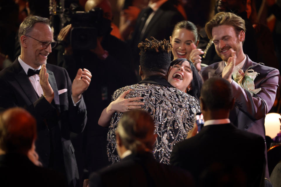 LAS VEGAS, NEVADA - APRIL 03: Billie Eilish congratulates Jon Batiste on his Album of the Year win for â€œWe Areâ€ during the 64th Annual GRAMMY Awards at MGM Grand Garden Arena on April 03, 2022 in Las Vegas, Nevada. (Photo by Matt Winkelmeyer/Getty Images)