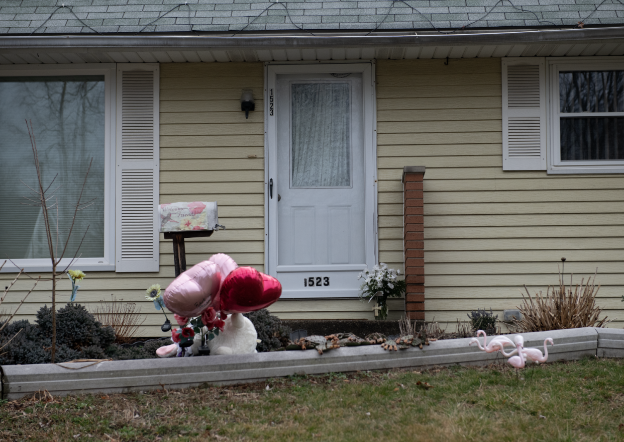 A memorial for Chandra Poudel-Rimal rests near the front steps of her Cuyahoga Falls home Wednesday, a day after her body was found in a wooded area along the Freedom Trail in Stow.