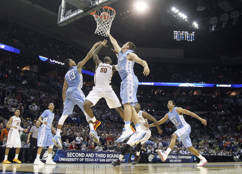 Mar 23, 2014; San Antonio, TX, USA; Iowa State Cyclones guard <a class="link " href="https://sports.yahoo.com/ncaab/players/88849/" data-i13n="sec:content-canvas;subsec:anchor_text;elm:context_link" data-ylk="slk:DeAndre Kane;sec:content-canvas;subsec:anchor_text;elm:context_link;itc:0">DeAndre Kane</a> (50) shoots the game winning shot against North Carolina Tar Heels forward <a class="link " href="https://sports.yahoo.com/nba/players/5518/" data-i13n="sec:content-canvas;subsec:anchor_text;elm:context_link" data-ylk="slk:J.P. Tokoto;sec:content-canvas;subsec:anchor_text;elm:context_link;itc:0">J.P. Tokoto</a> (13) and forward Jackson Simmons (21) in the second half of a men’s college basketball game during the third round of the 2014 NCAA Tournament at AT&T Center. Mandatory Credit: Soobum Im-USA TODAY Sports