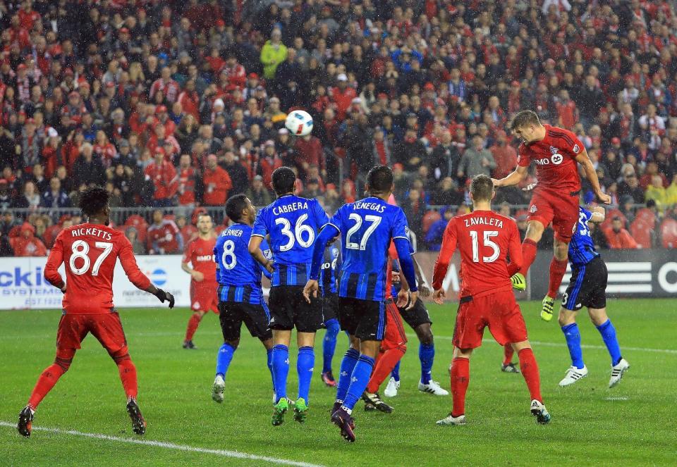 <p>Nick Hagglund #6 of Toronto FC scores a goal during the second half of the MLS Eastern Conference Final, Leg 2 game against Montreal Impact at BMO Field on November 30, 2016 in Toronto, Ontario, Canada. (Photo by Vaughn Ridley/Getty Images) </p>