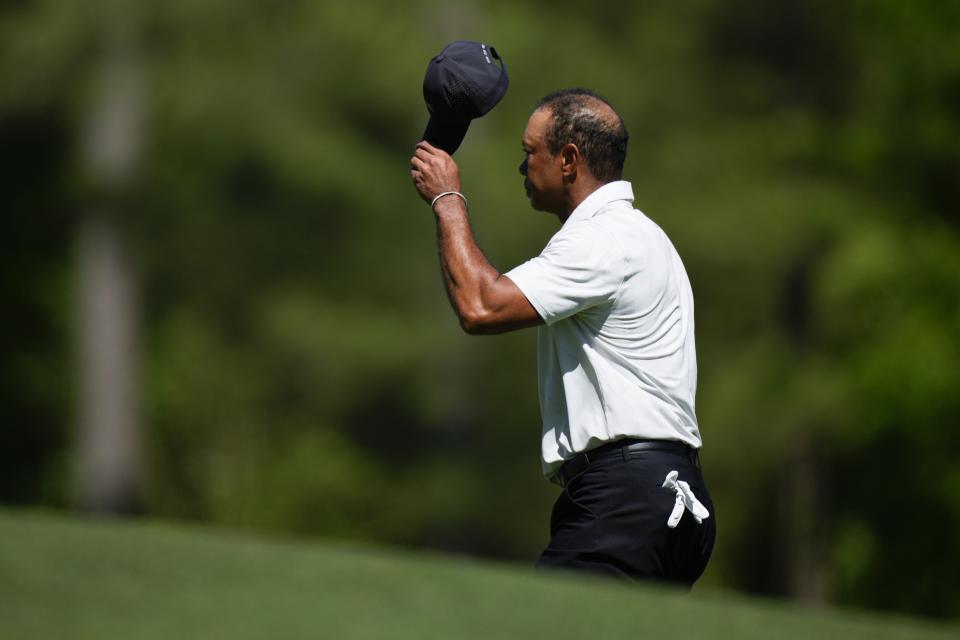 Tiger Woods waves after a putt on the 11th hole during third round at the Masters golf tournament at Augusta National Golf Club Saturday, April 13, 2024, in Augusta, Ga. (AP Photo/Matt Slocum)