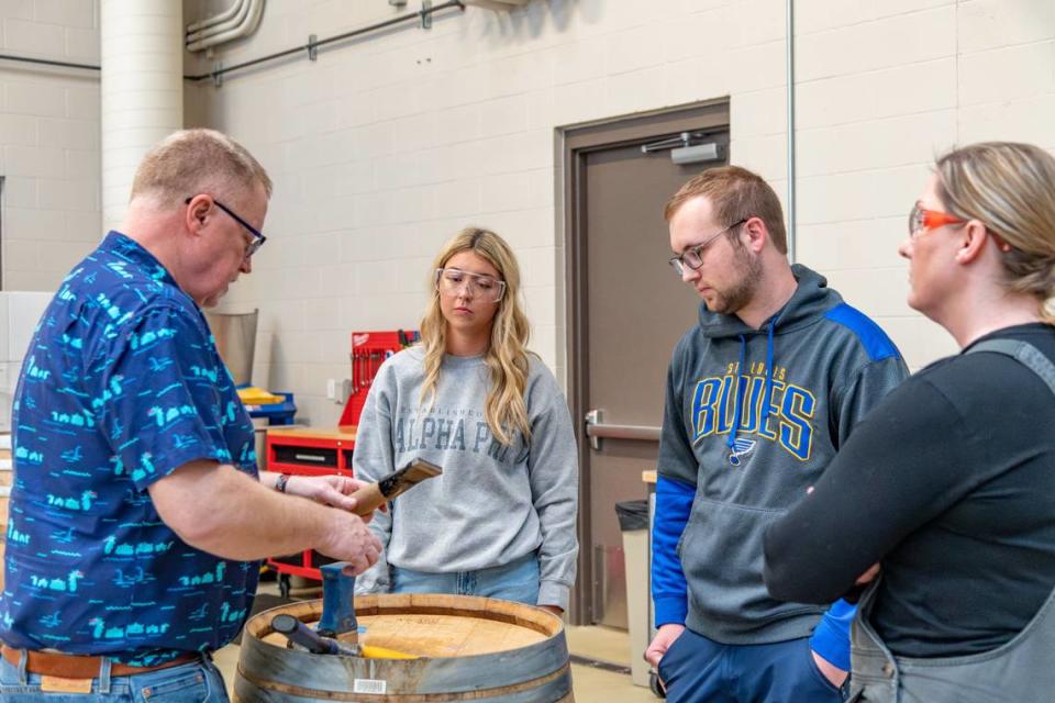 Students and staff in the Viticulture and Enology Department at WSU Tri-Cities deconstruct a wine barrel in April 2023.