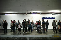 Commuters wait to board a train, in Gare du Nord railway station, in Paris, Friday, Sept. 13, 2019. Paris metro warns over major strike, transport chaos Friday. (AP Photo/Thibault Camus)