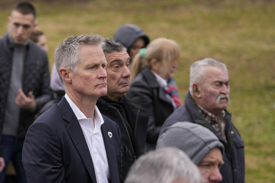 Golden State Warriors head coach Steve Kerr, left, attends the funeral of late Golden State Warriors assistant coach Dejan Milojevic in Belgrade, Serbia, Monday, Feb. 12, 2024. Milojevic, 46, died on Jan. 17, in Salt Lake City after heart attack. (AP Photo/Darko Vojinovic)