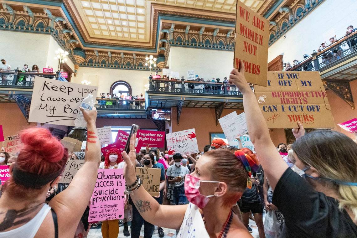 Protesters who support abortion access hold signs in the South Carolina State House lobby on Tuesday, June 28, 2022. While the House was not voting on abortion issues Tuesday, protesters were motivated by last week’s U.S. Supreme Court decision letting states decide their own laws on abortion restrictions.