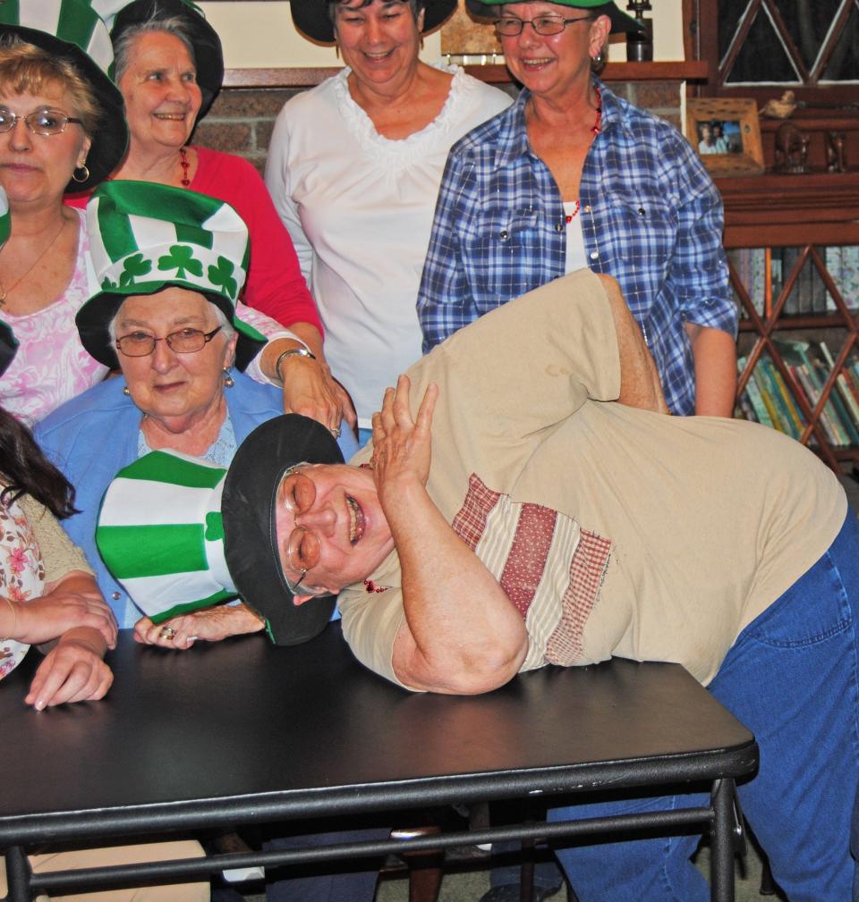Carolyn Suman cuts up with her fellow "Bunco Babes" during one of their light-hearted get-togethers around St. Patrick's Day in 2012. She was the unofficial president of the group of woman age 20 to 80 from all walks of life who got together regularly to play the dice game.