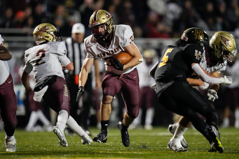 Nov 11, 2022; Westerville, Ohio, USA;  New Albany's Christian Manville (32) runs in the first half of the Div. I regional semifinal high school football playoff game against the Upper Arlington Golden Bears at Westerville Central. Mandatory Credit: Adam Cairns-The Columbus Dispatch