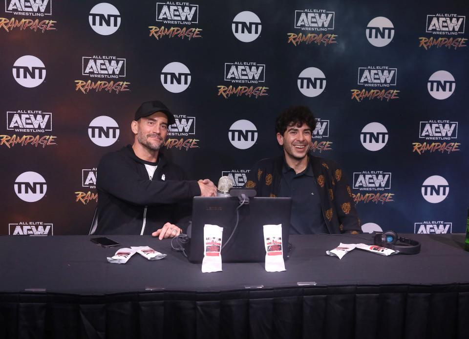 CM Punk, left, with AEW CEO Tony Khan.