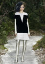 <b>Chanel SS13: </b>A model hits the runway in a quirky black and grey design.<br><br>© Reuters