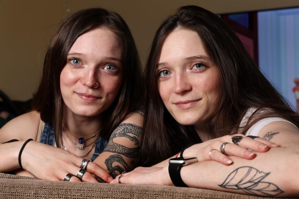 Hannah Case, left, and her twin sister Hailey Barton pose for photos in Saratoga Springs on April 26, 2023.