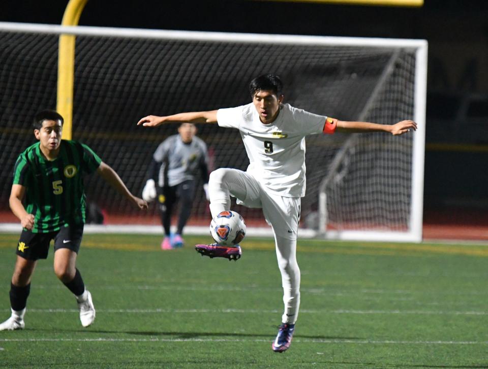 Oak Park's Charles Chowana controls the ball during the Eagles' 3-0 win over host Moorpark in a Coastal Canyon League match on Wednesday night.