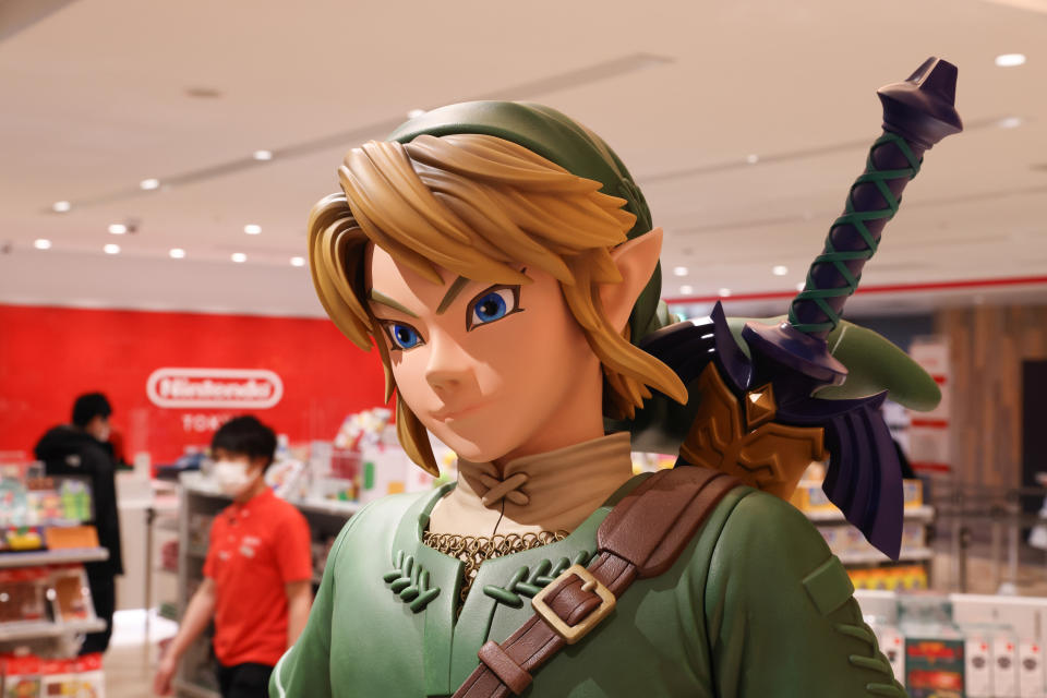 TOKYO, JAPAN - 2021/03/03: Link figurine from Legend of Zelda with shop staff inside Nintendo Tokyo store in Shibuya. (Photo by Stanislav Kogiku/SOPA Images/LightRocket via Getty Images)