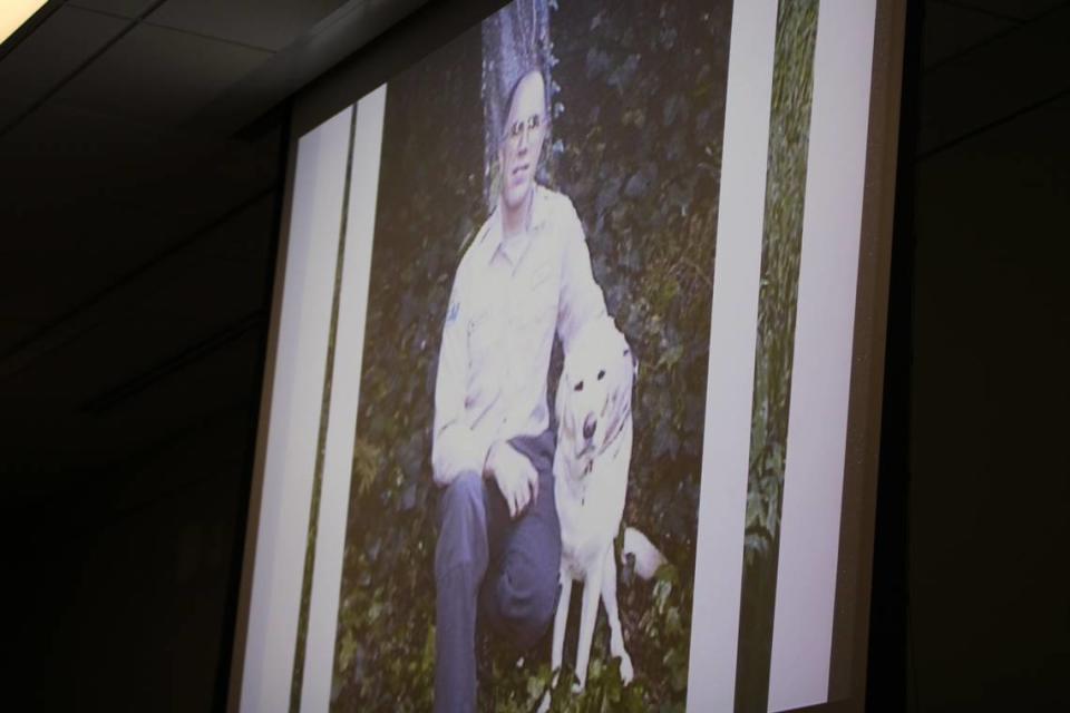 Wayne Behrens and his dog, Sierra, are shown on a projector to the juries overseeing the Kristin Smart murder trial in Monterey County Superior Court on Aug. 16, 2022. Behrens and his dog, Sierra, helped with law enforcement searches for Smart in 1996.