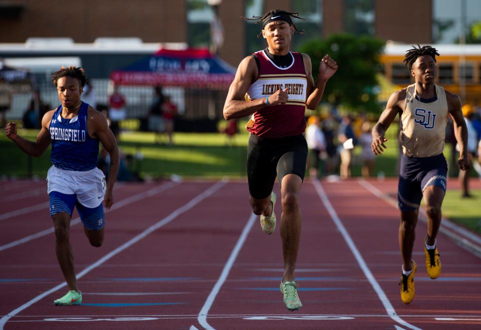 Licking Heights DJ Fillmore (middle) competes in the boys 200 at the 2022 OHSAA Track and Field State Tournament at Jesse Owens Memorial Stadium in Columbus, Ohio on June 3, 2022.