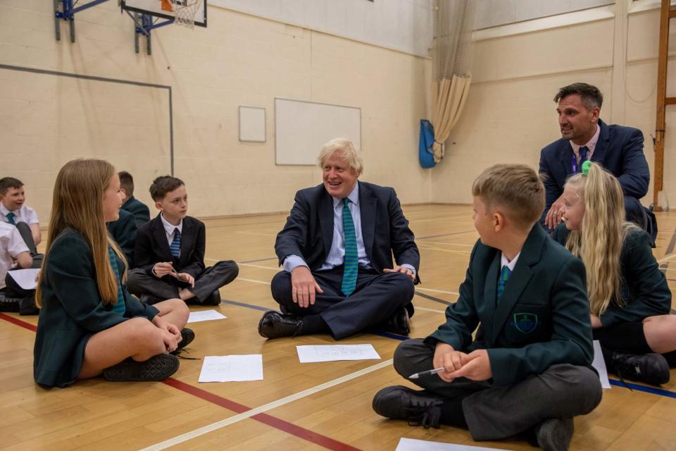 Boris Johnson spoke to pupils at Castle Rock School in Coalville (AP)