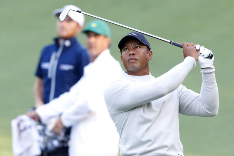 Tiger Woods hits an approach shot to the 10th hole in a practice round in the days before the Masters Tournament on Monday at Augusta National Golf Club in Augusta, Ga. Photo by John Angelillo/UPI