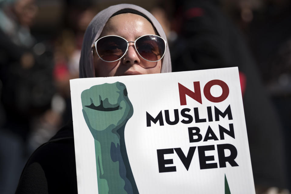 An activist in Los Angeles holds a sign on Oct. 15 during a protest against President Donald Trump's travel ban.&nbsp; (Photo: NurPhoto via Getty Images)