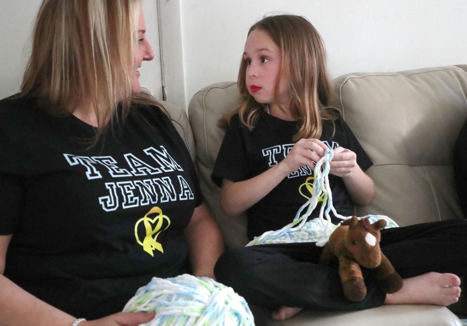 Kim Teachman and her daughter, Jenna, talk as Jenna crochets a top to wear during her chemo treatments at the family's Port Orange home. In November, Jenna took a fall off a horse that led to the diagnosis of Stage 4 pancreatic cancer.