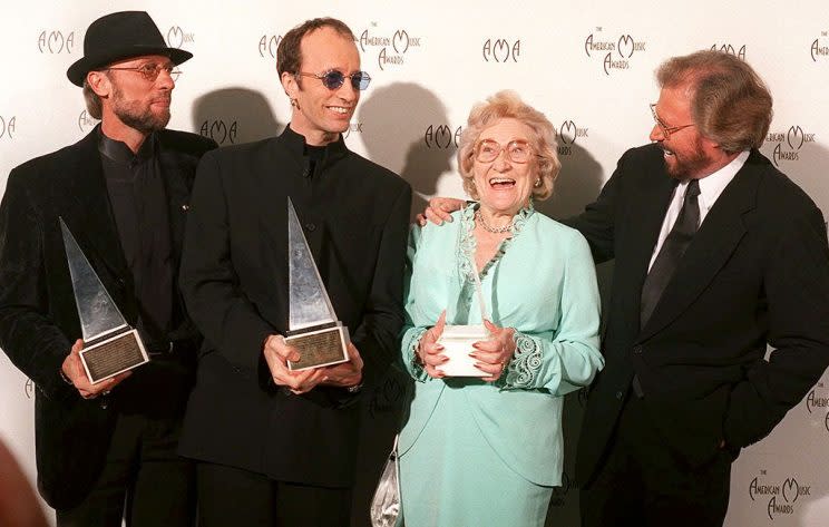 Barbara Gibb was the matriarch of the Gibb family, which included her sons in the Bee Gees (Barry, Maurice, and Robin Gibb, shown here) and Andy Gibb. She passed away on Aug. 12 at age 95, after outliving three of her children: Andy, Maurice, and Robin. (Photo: AP/Michael Caulfield)