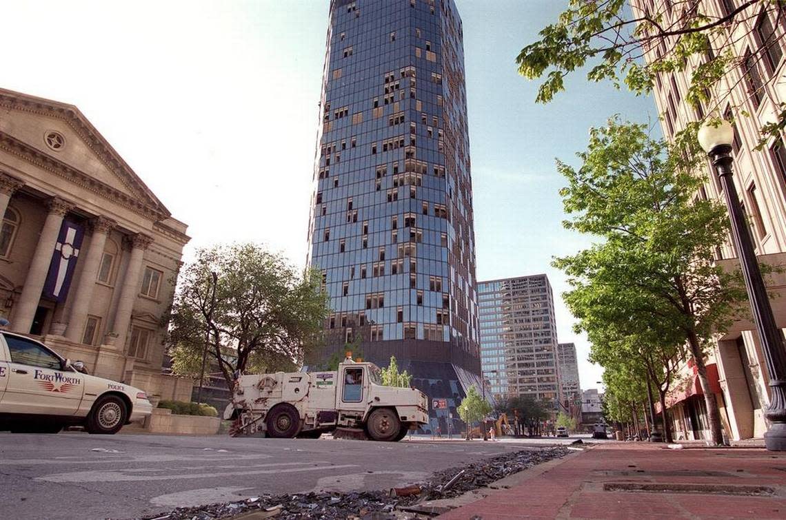A Fort Worth street sweeper picks up broken glass downtown following the March 2000 tornado. The City Council has approved “standby” contracts for natural disasters.